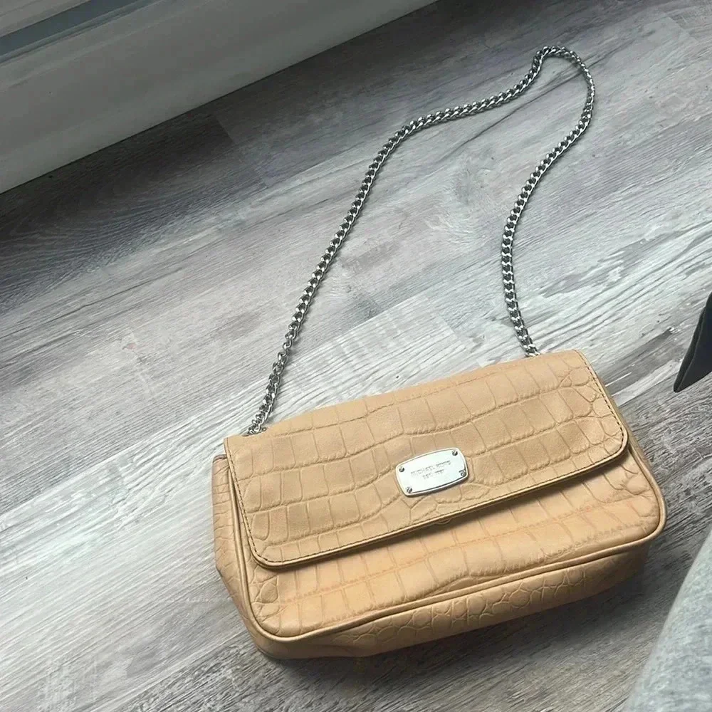 Tan Michael Kors envelope chain crossbody purse with adjustable straps